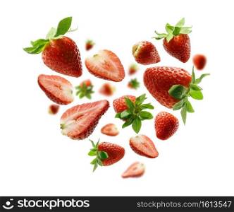 Red strawberries in the shape of a heart on a white background.. Red strawberries in the shape of a heart on a white background