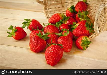 Red strawberries on old wood table
