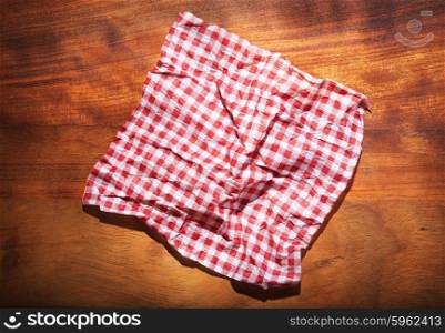red tablecloth on old wooden board