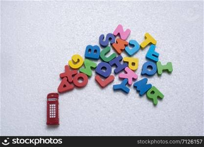 Red telephone booth model and colorful wooden letters