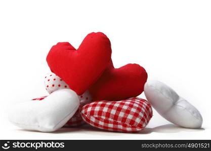 Red textile hearts isolated on white background