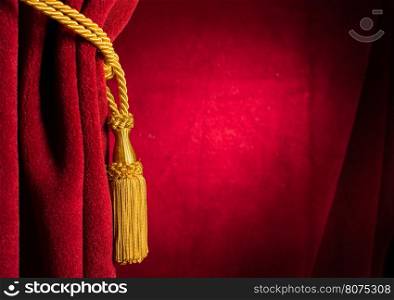 Red theatre curtain and yellow tassels