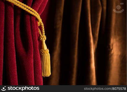 Red theatre curtain and yellow tassels