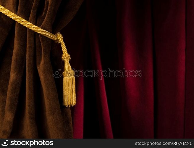 Red theatre curtain and yellow tassels