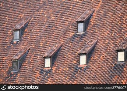 Red tile roof with many windows old town Gdansk Poland