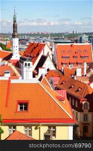 Red tiled roofs of Old town of Tallin with Holy Spirit Church tower, Estonia