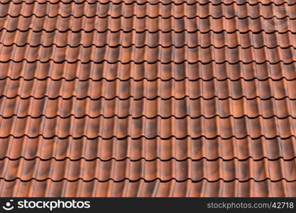 Red tiles roof background texture of a house