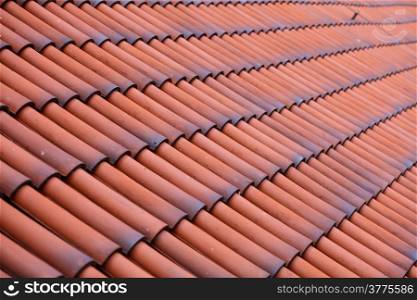 Red tiles roof texture architecture background, detail of house close up