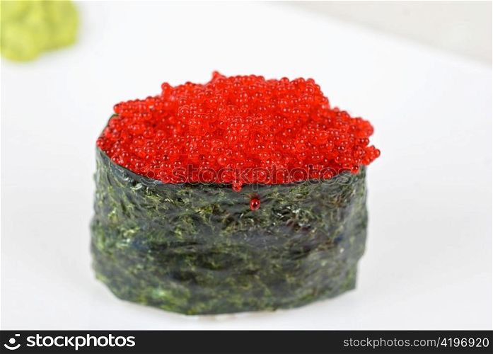 Red tobiko (flying fish roe) sushi closeup