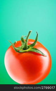 Red tomato against gradient background