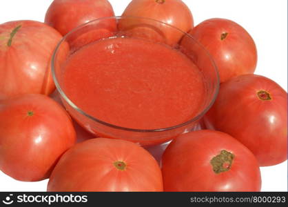 Red tomato and tomato sauce in a glass bowl