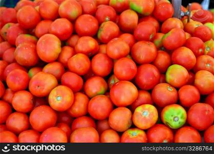 red tomato mound in vegetables market pattern background