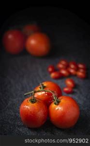 red tomato on wood background