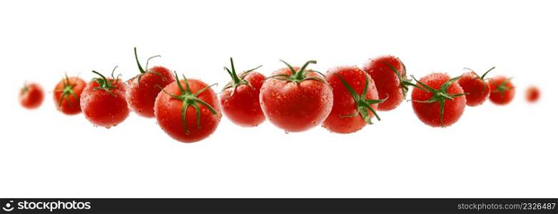 Red tomatoes levitate on a white background.. Red tomatoes levitate on a white background