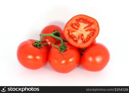 Red tomatoes on the branch isolated on white