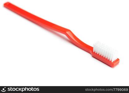 red toothbrush isolated on white