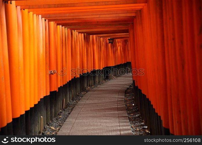 Red Tori Gate at Fushimi Inari Shrine in Kyoto , Japan