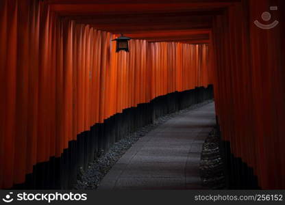 Red Tori Gate at Fushimi Inari Shrine in Kyoto , Japan