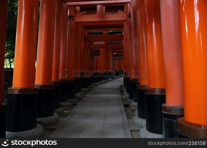Red Tori Gate at Fushimi Inari Shrine in Kyoto , Japan