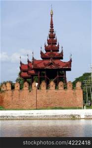 Red tower brick wall and moat, Mandalay palace in Myanmar