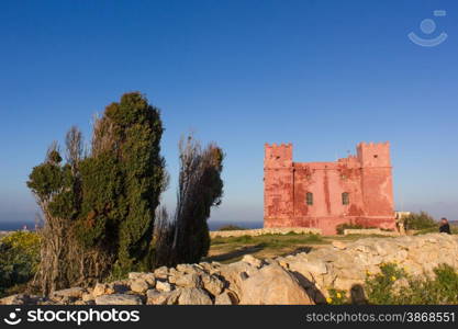 Red tower Malta. typical watchtower military purposes on the coasts of Malta