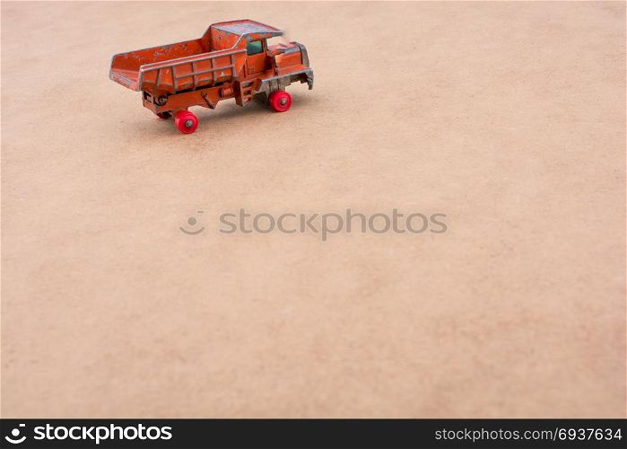 Red Toy car truck on a wooden background