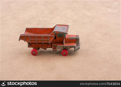 Red Toy car truck on a wooden background