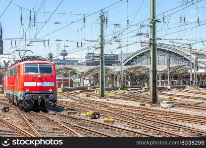 red train depart from the station Cologne Germany.