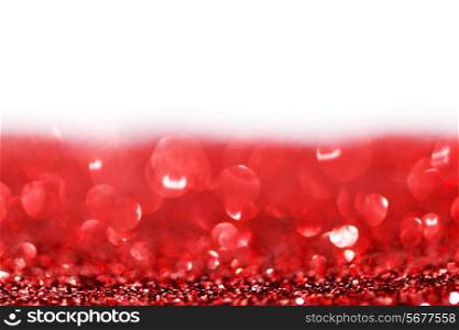 Red twinkling lights abstract holiday background with white copy space