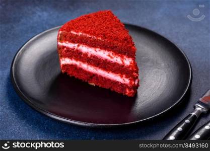 Red velvet cake, classic three layered cake from red butter sponge cakes with cream cheese frosting, American cuisine. Red velvet cake, classic three layered cake from red butter sponge cakes with cream