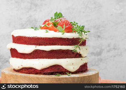 Red velvet cake on wood board. Strawbwrry cake. Devils cake. Wedding dessert. Birthday party. Delicious dessert. Traditional american dessert.