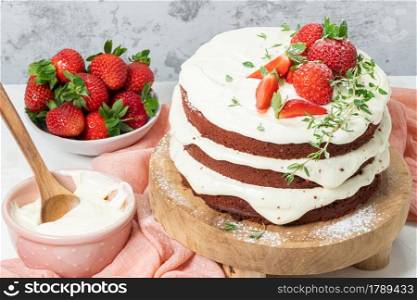 Red velvet cake on wood board. Strawbwrry cake. Devils cake. Wedding dessert. Birthday party. Delicious dessert. Traditional american dessert.