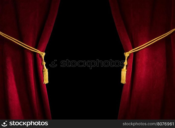 Red velvet curtain with tassel. Close up black isolated curtain