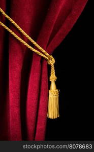 Red velvet curtain with tassel. Close up black isolated curtain