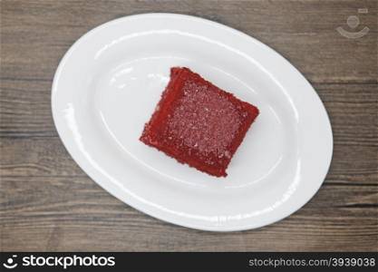 Red Velvet, fresh delicious diet cake at Dukan Diet on a porcelain plate on a wooden background