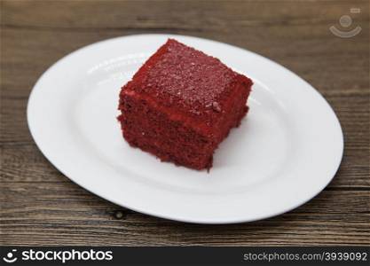 Red Velvet, fresh delicious diet cake at Dukan Diet on a porcelain plate on a wooden background