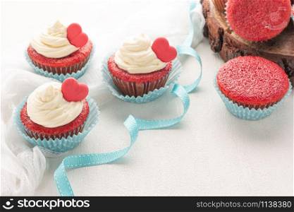 Red velvet heart cupcake with cream cheese frosting and a red heart for Valentine&rsquo;s Day