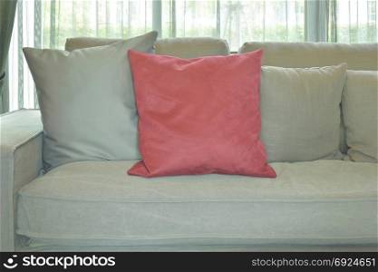 Red velvet pillow with gray color couch and pillows in living room