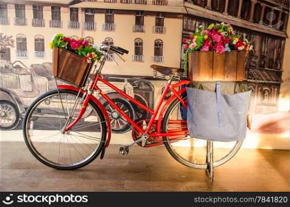 red vintage bicycle with flower
