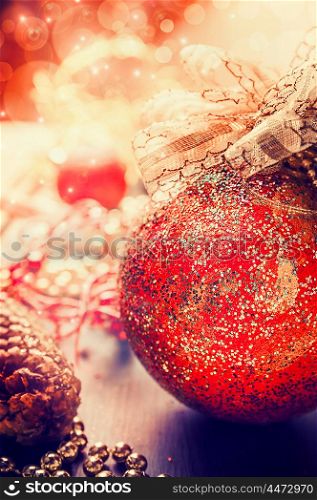 Red vintage Christmas bauble on glitter background