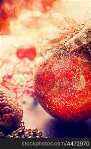 Red vintage Christmas bauble on glitter background
