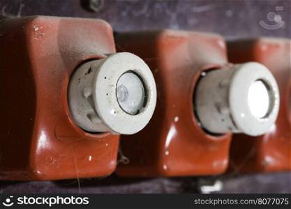 Red vintage electrical fuse. Switchboard