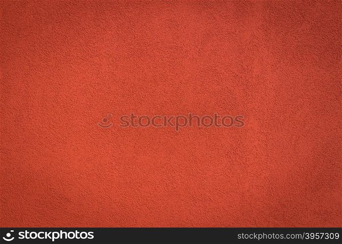 Red wall background and texture with vignetting and blank copyspace for text or advertising.