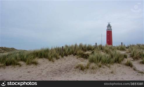 red watchtower and sand dunes in holland