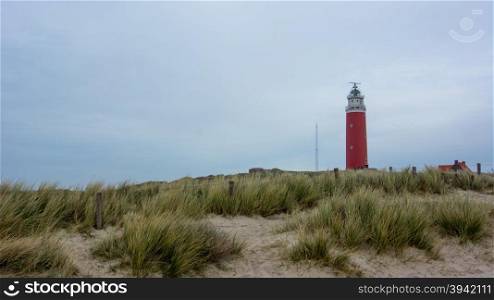 red watchtower and sand dunes in holland
