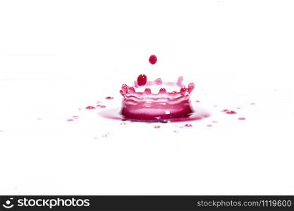 Red water splashes On a white background, photography. Red water splashes.