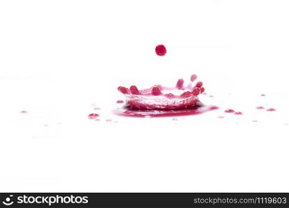 Red water splashes On a white background, photography. Red water splashes.