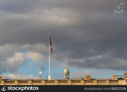 Red, White and Blue French flag on Paris landmark. Paris, France.