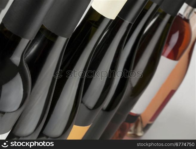 Red white and rose wine bottles in a row