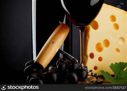 red wine and cheese on black